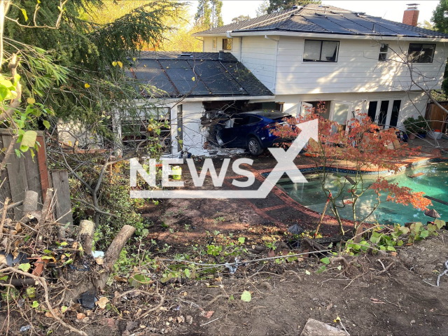 Photo shows vehicle that crashed into a home, undated. Woman lost control with her Tesla and flew over a swimming pool in San Mateo, California on Friday, November 17, 2023. Note: Licensed photo(@CityofSanMateoPolice/Newsflash).