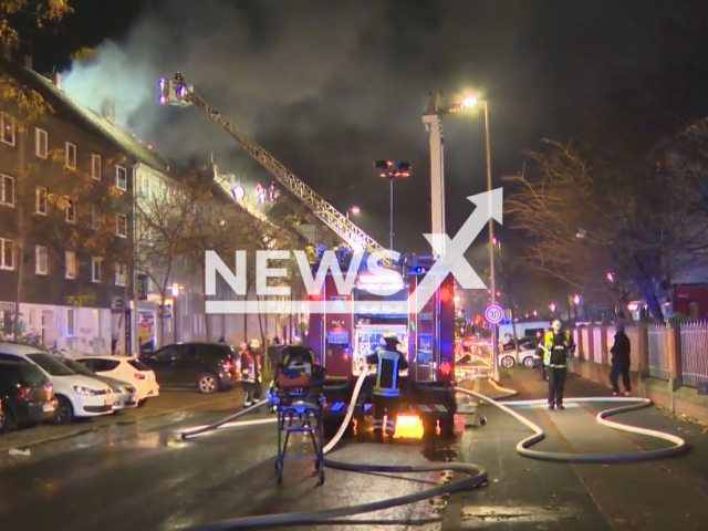 Fire fighters attempt to put out a  fire at a house owned by Kursat Yildirim, in Dortmund, Germany, on Friday, Nov. 24, 2023. Twenty people had to be evacuated. 
Note: Photo is a screenshot from video. (Newsflash)