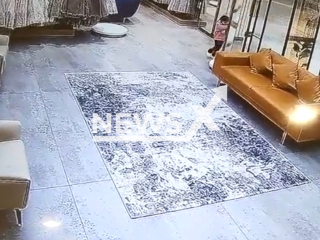 A glass panel falls on a three-year-old girl in Ludhiana, India, undated. The girl was declared dead by the doctors at a hospital. Note: Picture is a screenshot from the video. (Newsflash)