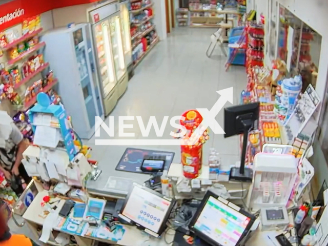 An alleged thief hides his face using a cardboard box in Borgos, Spain, undated. He was arrested following the incident. Note: Picture is screenshot from a video. (Newsflash)