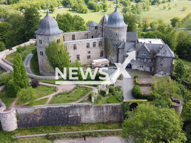 Image shows the Sababurg, also known as the Sleeping Beauty Castle, located in the legendary Reinhardswald, a forested upland in the county of Kassel, Hesse State, Germany. German authorities have built wind power plants around it to help replace fossil fuels. Note: Photo is a screenshot from a video. (Newsflash)