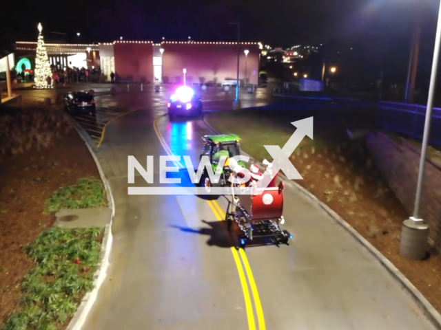 Image shows Santa being escorted to Christmas in the Courtyard, undated photo. It happened in the city of Merriam, Kansas State, USA, on Dec. 6, 2023. Note: Photo is a screenshot from a video. (Merriam Police Department/Clipzilla)