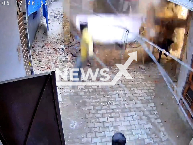 A part of a house collapses on a woman and her child in Manimajra, Chandigarh, India. Both suffered injuries.Note: Picture is screenshot from a video. (Newsflash)