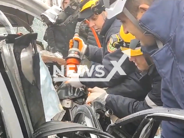 Emergency crews cut a passenger out of a car out after a a collision, in Baku, Azerbaijan. Note: Picture is a screenshot from the video. (Ministry of Emergency Situations/Clipzilla)