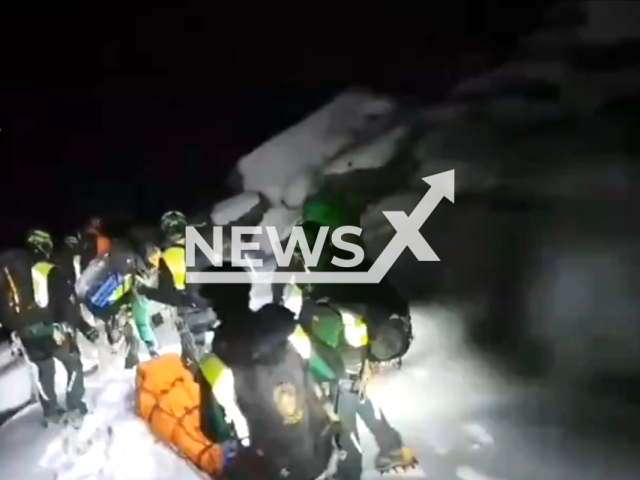 Crews rescue the lifeless body of a mountaineer who died after falling down an icy slope in the vicinity of the Tajos de la Virgen, in Granada, Spain. Note: The picture is a screenshot from the video. (Clipzilla)