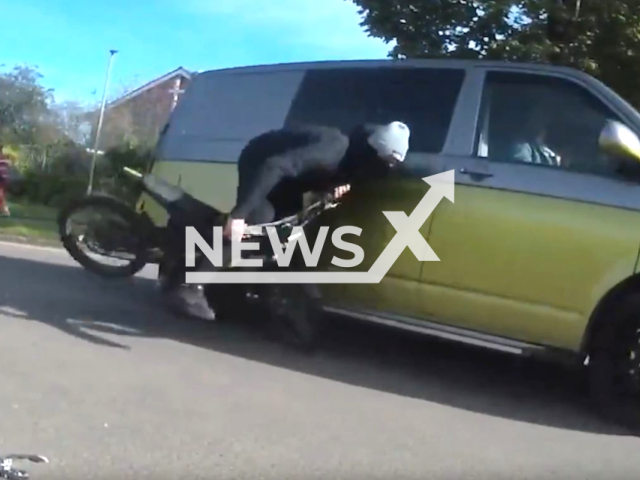 Drug dealer Kya Evans crashes his suron bike while riding it illegally in front of a off-duty officer who detains him, in South Wales Police, Whales, UK, on Oct. 15, 2023.
Note: Picture is screenshoot from a video (South Wales Police/Clipzilla)