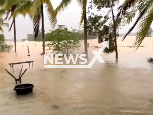 Woman describes flooding before evacuation, in Daintree, Queensland, Australia, on Monday, Dec. 18, 2023. Note: The picture is a screenshot from the video. (Daintree Gateway Fruit Stall/Clipzilla)