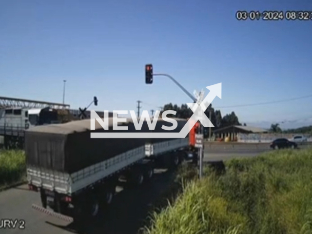 A train crashes into a lorry in Ponta Grossa, in Campos Gerais de Parana, Brazil, Wednesday, Dec. 30, 2023. The truck driver was not injured. Note: Picture is a screenshot from the video. (Newsflash)