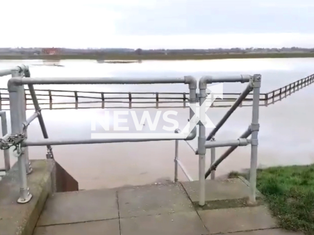 Willerby and Derringham Flood Alleviation lagoon filling with water as flood warnings are issued, in Hull, UK. Note: Picture is a screenshot from the video. (@englandsfavour/Clipzilla)