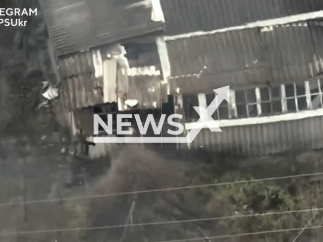 Ukrainian attack drone destroys the Russian military position inside an abandoned building in the occupied part of Ukraine in undated footage. The footage was released by the State Border Guard Service of Ukraine on Tuesday, Jan. 9, 2024.Note: Picture is screenshot from a video. (@DPSUkr/Newsflash)