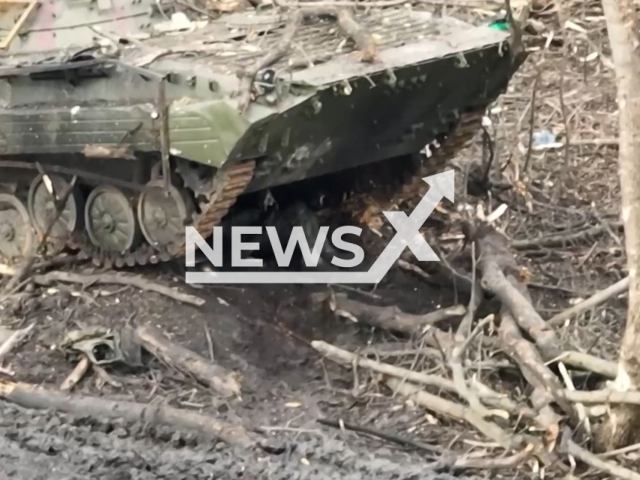 Ukrainian drone hit hiding Russian soldiers behind the destroyed war machines on the battlefield near Avdiivka in Ukraine in undated footage. The footage was released by the 47th Separate Mechanized Brigade on Tuesday, Jan. 9, 2024. Note: Picture is screenshot from a video. (@brygada47/Newsflash)