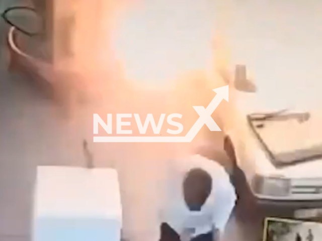 A car bursts into flames at a petrol station in Adana, Turkey, undated. A person inside the car kicks open the door and escapes the flames.  Note: Picture is screenshot from a video. (Newsflash)