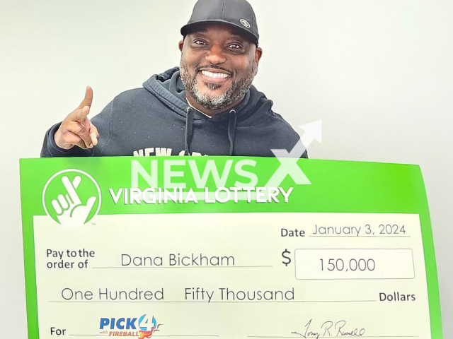 Dana Bickham poses with his prize-winning check, undated. He won a total of USD 150,000 in a single  drawing with 30 tickets  all with the same four-digit combination of 1-1-2-9. Note:  Virginia Lottery photo (Virginia Lottery/Newsflash)