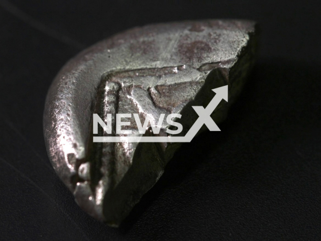 Rare silver coin dating from the Persian period (5-6th Centuries BCE), discovered in a First Temple-era house in the Judean Hills, in an image released on January 17, 2024. A small arrowhead was also discovered at the site. Note: Licensed photo (Emil Aladjem, Israel Antiquities Authority/Newsflash)