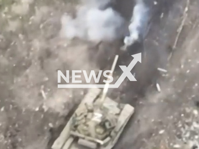 Soldiers of the Prince Ostroh Brigade destroyed a Russian tank in the woods, in April, 2022, in Ukraine. Note: Picture is a screenshot from a video (@30brigade/Newsflash)