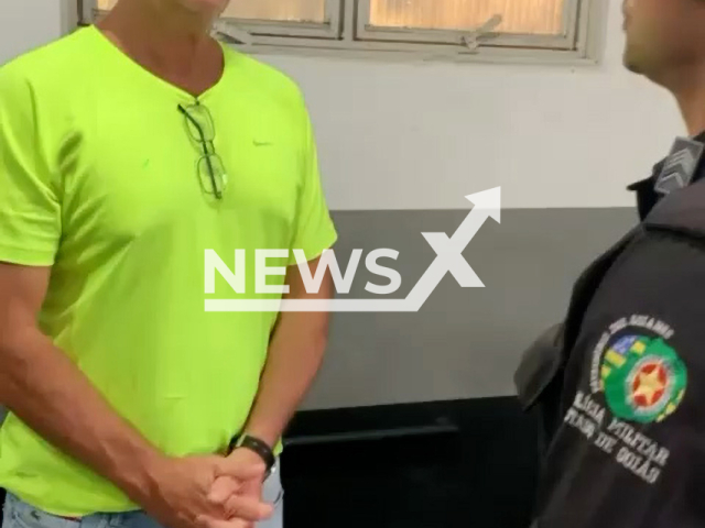 Robert Witchell speaks with police officers in undated footage. He was rescued from a clandestine clinic in Caldas Novas, Brazil.Note: Picture is screenshot from a video. (PMGO/Newsflash)