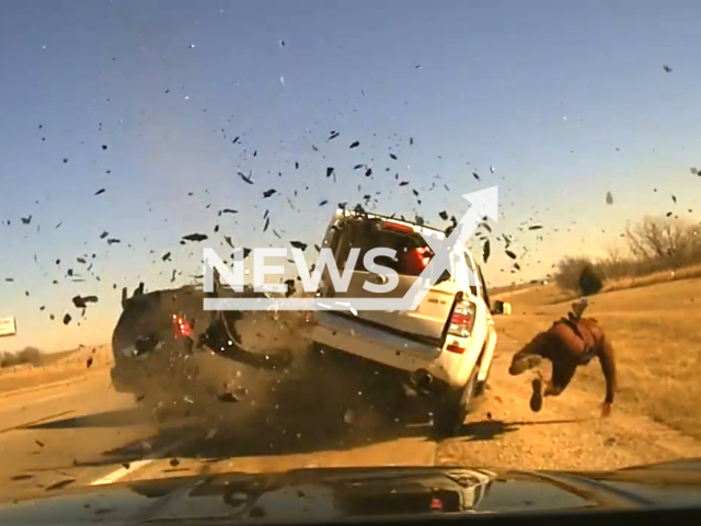 Photo captures the unsettling moment when Trooper Jesse Gregory is struck by a vehicle during a traffic stop on I-40 at Cimarron Road in Oklahoma on 18 January. Note: Picture is a screenshot from the video. (Oklahoma Highway Patrol/Clipzilla)