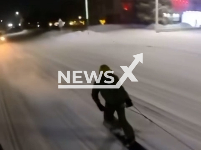 A police car chases two snowboarders in Jitiqara, Kazakhstan, undated. Snowboarders and the driver of the vehicle were arrested for gross violation of traffic rules.Note: Picture is screenshot from a video. (@POLICE_of_KZ/Newsflash)