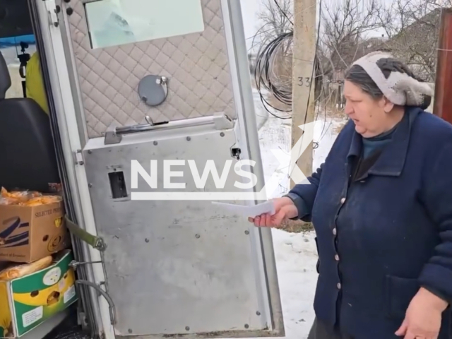 Police group deliver food to residents still living in the semi-destroyed of Torske, Ukraine.. Note: Picture is a screenshot from the video. (Ministry of Internal Affairs of Ukraine/Clipzilla)