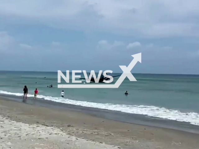 Footage shows the plane swooping low in shallow waters south of Cocoa Beach in Florida. Note: Photo is a screenshot from the video (@reefbreak/Clipzilla)