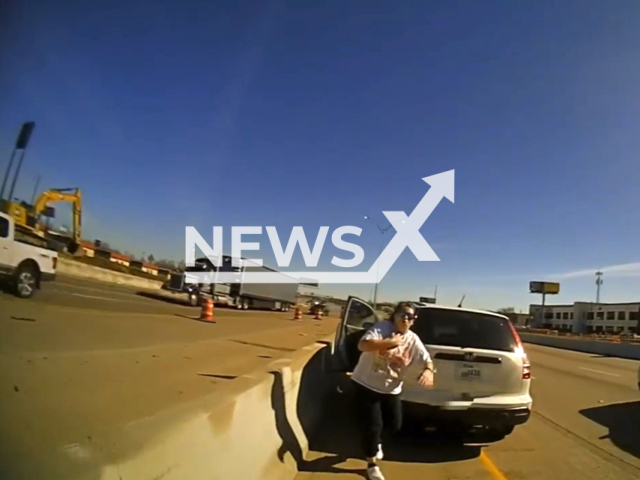 Officer Chad Stevens saves life of a choking woman on Interstate Highway 20, on Mansfield, Texas, USA, on Saturday, Jan. 13, 2024. Note: Picture is a screenshot from the video. (Mansfield Police Department/Clipzilla)