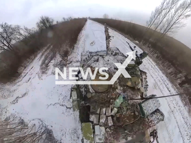 Russian Army crews of T-80BV tanks destroy the fortifications of Ukrainian militants and armored vehiclesin the Kupyansk direction, Ukraine Note: Picture is a screenshot from the video. (Ministry of Defense of the Russian Federation/Clipzilla)