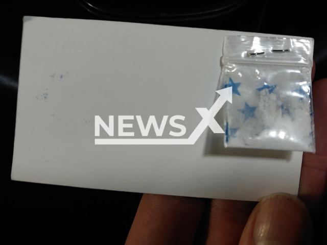 Photo shows drug business card, undated. Canadian drug dealer Seyyed Amir Razavi was busted for passing out 'free samples' of cocaine stapled to the back of his business cards.
Note: Licensed photo(Calgary Police Media Relations/Newsflash).