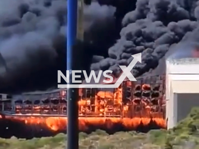 A fire in a warehouse spreads potentially dangerous smoke in Kwinana, Australia, on Friday, Feb. 9, 2024. Note: Picture is a screenshot from the video. (Department of Fire and Emergency Services WA/Clipzilla)