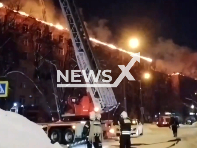 Footage shows firefighters and burning residential buildings in Moscow, Russia at night on Friday, Feb. 9, 2024. Note: Picture is screenshot from a video. (@mchs_official/Clipzilla)