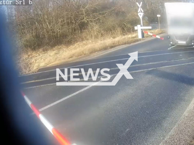 A motorist avoids getting hit by a train at the last minute in Nemeskeresztur, Hungary, Wednesday, Feb. 7, 2024. The motorist survived the incident without injury. Note: Picture is screenshoot from a video (Newsflash)