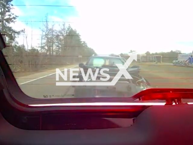 Car slams into police car on US-127, in Clinton County, Michigan, USA, on Thursday, Feb. 8, 2024. Note: Picture is a screenshot from the video. (Clinton County Michigan Sheriff's Office/Clipzilla)