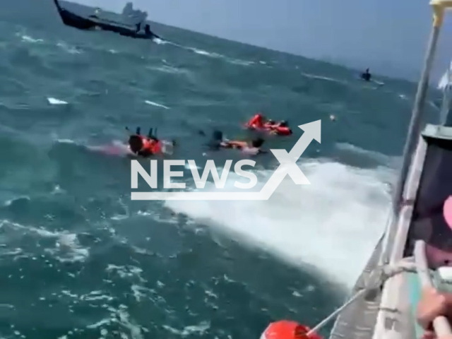 Russians and Ukrainians jointly rescued Chinese tourists caught in a stormy sea in Thailand, undated. They fell into the sea when the boat crashed during an excursion.Note: Picture is screenshot from a video. (@REAL_PHUKET/Newsflash)