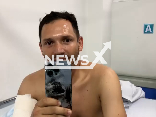 Photo shows Captain Javier Leal, commander of the Special Forces Unit, undated. He survived lethal attack in Segovia, Antioquia, Colombia, thanks to a bullet embedded in his mobile phone.bNote: Picture is screenshot from a video. (@FuerzasMilitaresColombia/Newsflash)