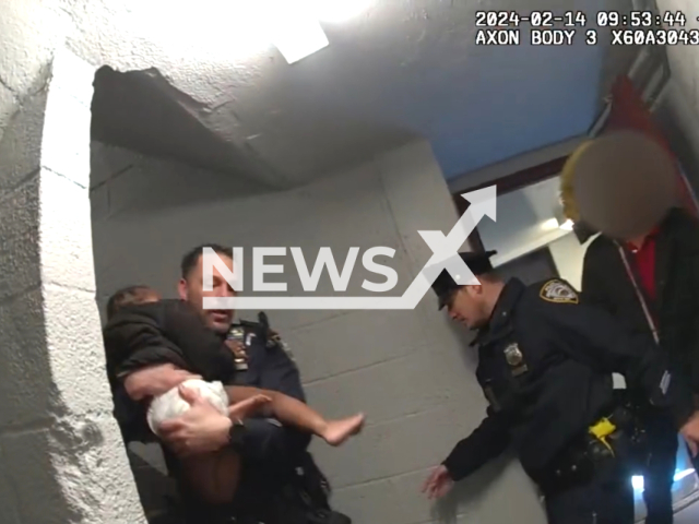 NYPD officers evacuate numerous residents, from a building fire in New York City New York, USA, on Wednesday, Feb.14, 2024. Note: Picture is a screenshot from the video. (NYPD/Clipzilla)