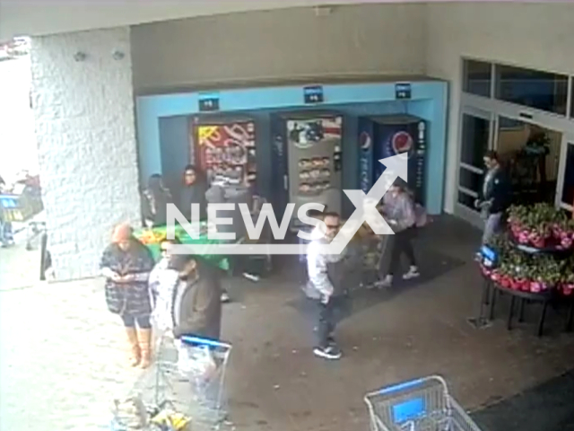 A man steals money from  a Girl Scout cookie stand,  in Fort Worth, Texas, USA, on Sunday, Feb. 11, 2024. Note: Picture is a screenshot from the video. (Fort Worth Police/Clipzilla)