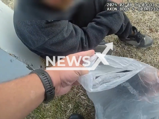 Deputy Buster provided blankets, food, and clothing to a homeless individual in Bernalillo County, New Mexico, USA, in February 2024. Note: Picture is a screenshot from the video. (Bernalillo County Sheriff's Office/Clipzilla)