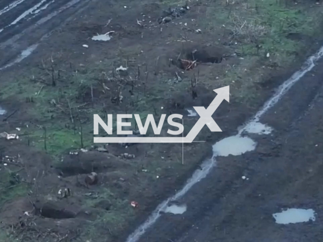 Ukrainian kamikaze drone hits Russian solider trying to shoot the drone with a machine gun in Ukraine in undated footage. The footage released by the 10th Army Corps of the Armed Forces of Ukraine on Wednesday, Feb. 21, 2024. Note: Picture is screenshot from a video. (@10ArmyCorps/Newsflash)