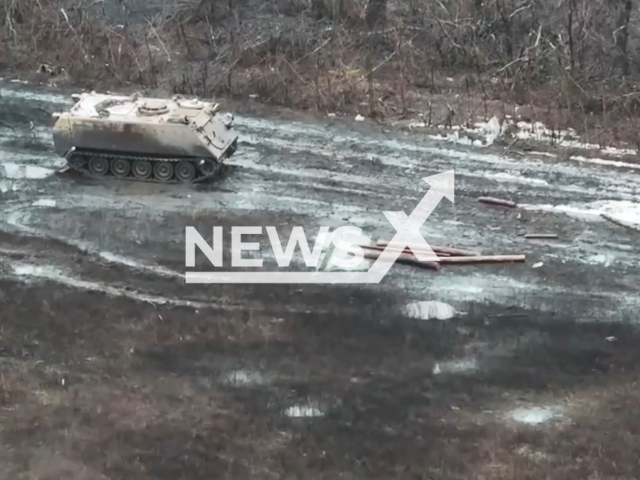 A mechanic-driver of an M113 armored personnel carrier from the Ukrainian forces skillfully maneuvers, rescuing wounded comrades while shielding them from relentless enemy fire in Ukraine in undated footage. The footage released by the 63rd Separate Mechanised Brigade of the Armed Forces of Ukraine on Thursday, Feb. 22, 2024.  Note: Picture is screenshoot from a video (@ombr_63/Newsflash)