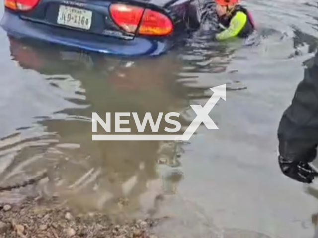 Roma police officers certified in swift water rescue, alongside the Roma Fire Dept, recovered a vehicle from the Rio Grande River in Roma-Los Saenz, TX, United States on February 22.. Note: Picture is a screenshot from the video. (City of Roma Police Department/Clipzilla)