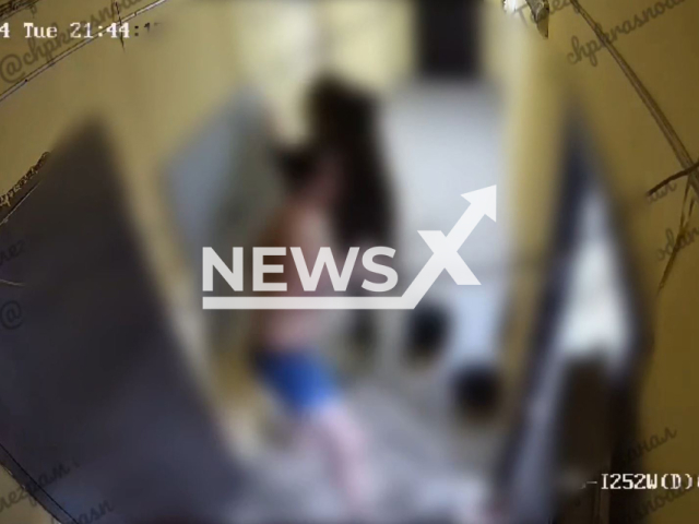 A man beat his wife and their daughter in the stairwell of an apartment building in Krasnodar, Russia, Feb. 20, 2024. The police are after the man. Note: Picture is screenshoot from a video (@mvd23krasnodar/Newsflash)