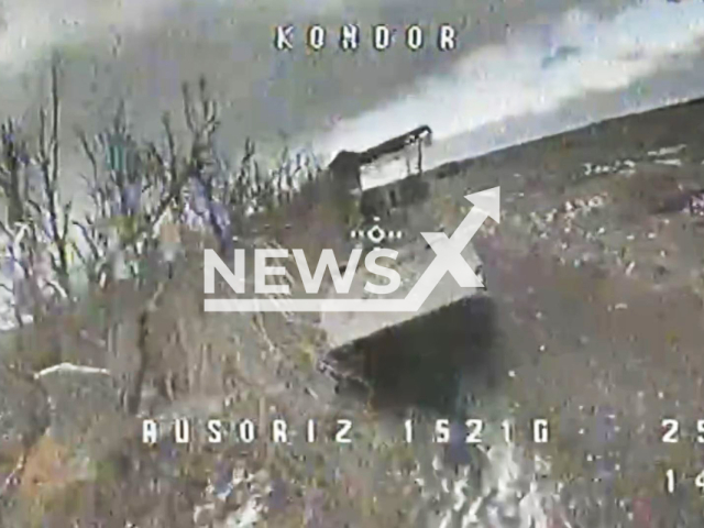 Ukrainian kamikaze drone hits Russian armored vehicle on the frontlines in Ukraine in undated footage. The footage was released by the First Presidential Brigade of the National Guard of Ukraine on Wednesday, Feb. 28, 2024. Note: Picture is screenshot from a video (@NGU3027/Newsflash)