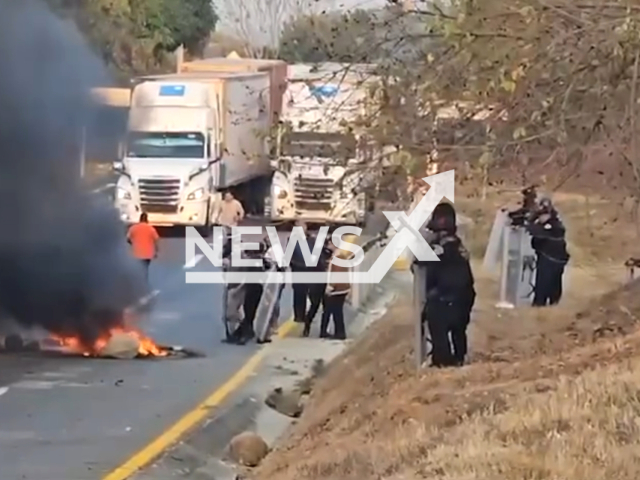 Police evict a group of people who were blocking vehicular traffic with stones and sticks, in Mapastepec,  Mexico. Note: Picture is a screenshot from the video. (Secretaria de Seguridad y Proteccion Ciudadana/Clipzilla)