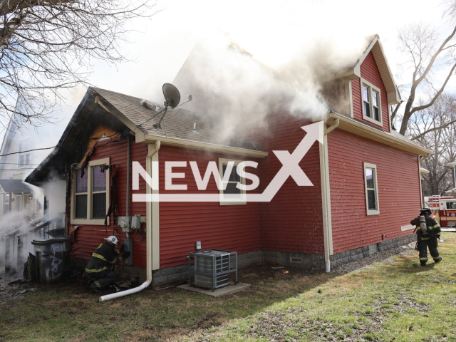 Firefighters put out a  heavy fire in a rental home in Indianapolis, Indiana, USA, on Wednesday, Feb. 28, 2024.  One adult and five children were displaced. Note: Private photo. (Indianapolis Fire Department/Clipzilla)