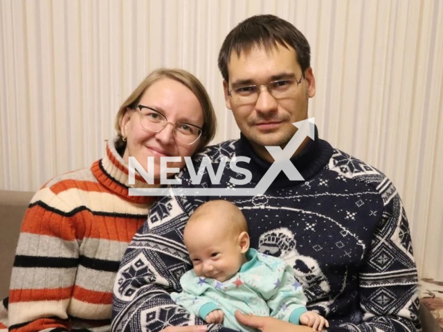 Photo shows Elena and Gleb Ivanov with their son, Dima, undated. Dima allegedly lived for several months with a catheter stuck in his heart in Yekaterinburg, Russia. Note: Picture is private (Gleb Ivanov/Newsflash)