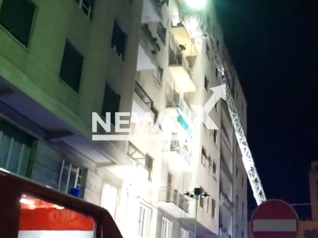 Rescue with a ladder truck of two people stuck in a fire at Savona, Italy, on Sunday, March 3, 2024. Note: Picture is a screenshot from the video. (@vigilidelfuoco/Clipzilla)