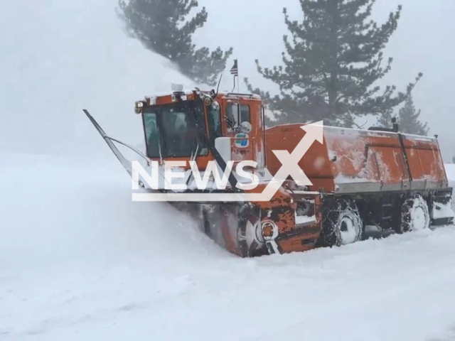 A snowblower clears a road near Kingvale, California, USA, in March, 2024. Note: Picture is a screenshot from the video. (Caltrans District 3/Clipzilla)