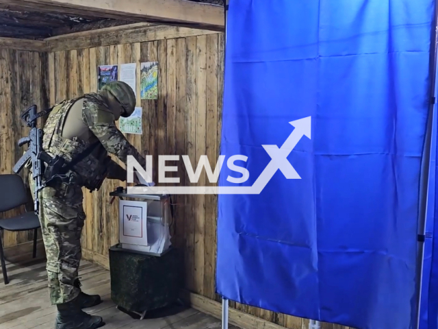 Servicemen of the self-propelled artillery regiment and special forces unit of the Center group of troops vote in the Avdiivka area, Ukraine. Note: Picture is a screenshot from the video. (Ministry of Defense of the Russian Federation/Clipzilla)