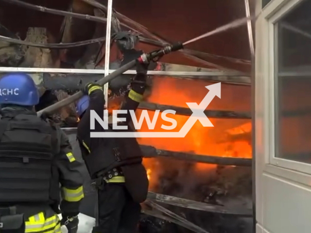 Rescuers extinguish fire at wheelhouses hit by Russian forces, in Nikopol, Ukraine, on Wednesday, March, 6, 2024. Note: Picture is a screenshot from the video. (Ministry of Internal Affairs of Ukraine/Clipzilla)