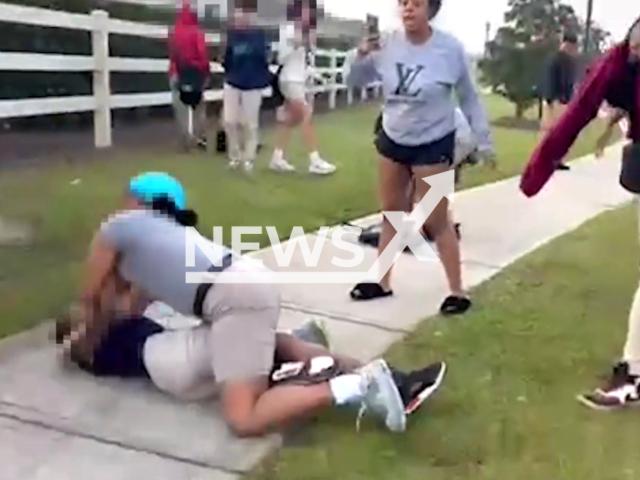 Taityana D. Duffy, 28, breaks up a fight between students at a bus stop and attacks one, in Haines City, Florida, USA, on Friday, March 1, 2024. Note: Picture is a screenshot from the video. (Haines City Police Department/Clipzilla)