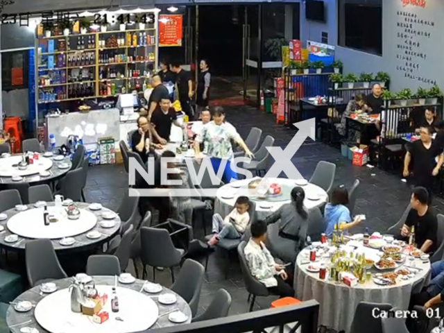 Child standing on restaurant chair saved from falling by man in Taizhou, Zhejiang in China. Note: Picture is a screenshot from a video (MYH499097721/AsiaWire)